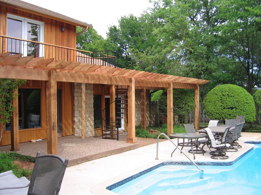 Spiral exterior stairway, pergola patio and pool